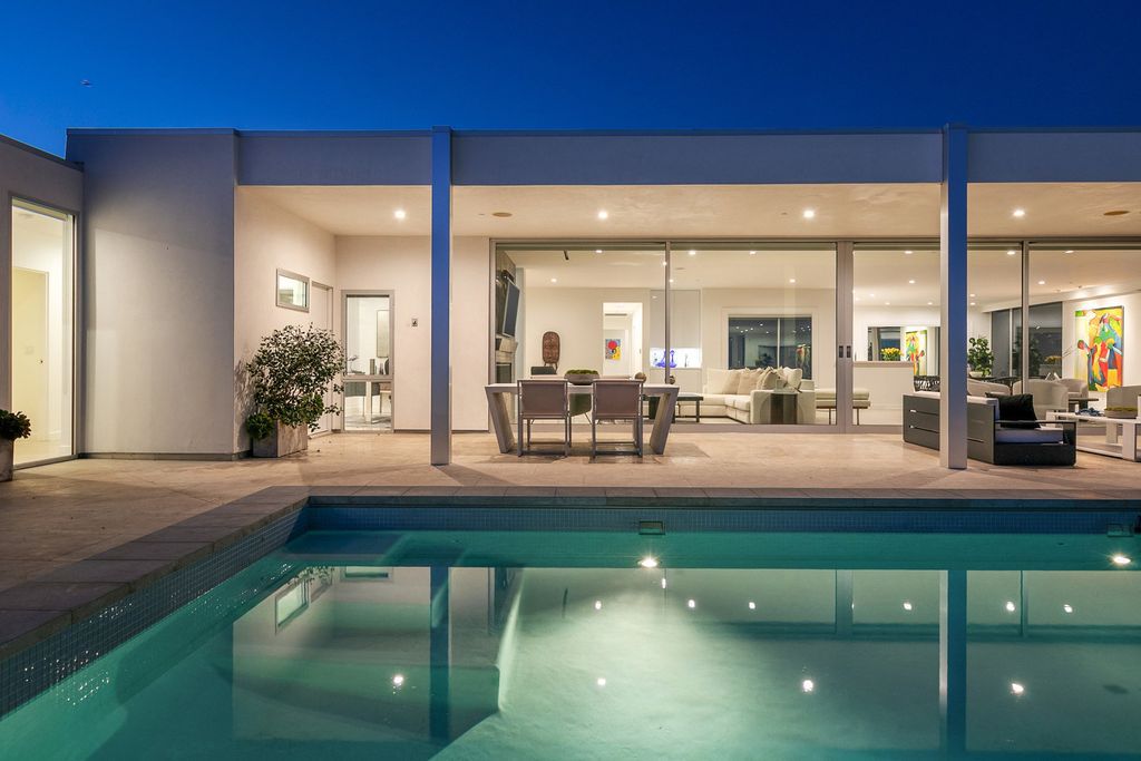 The Home in Beverly Hills is a totally remodeled and updated contemporary estate with head on city to ocean views now available for sale. This home located at 1476 Carla Rdg, Beverly Hills, California
