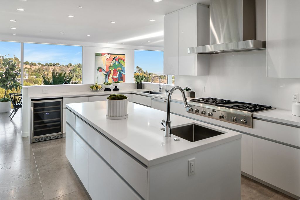 The Home in Beverly Hills is a totally remodeled and updated contemporary estate with head on city to ocean views now available for sale. This home located at 1476 Carla Rdg, Beverly Hills, California