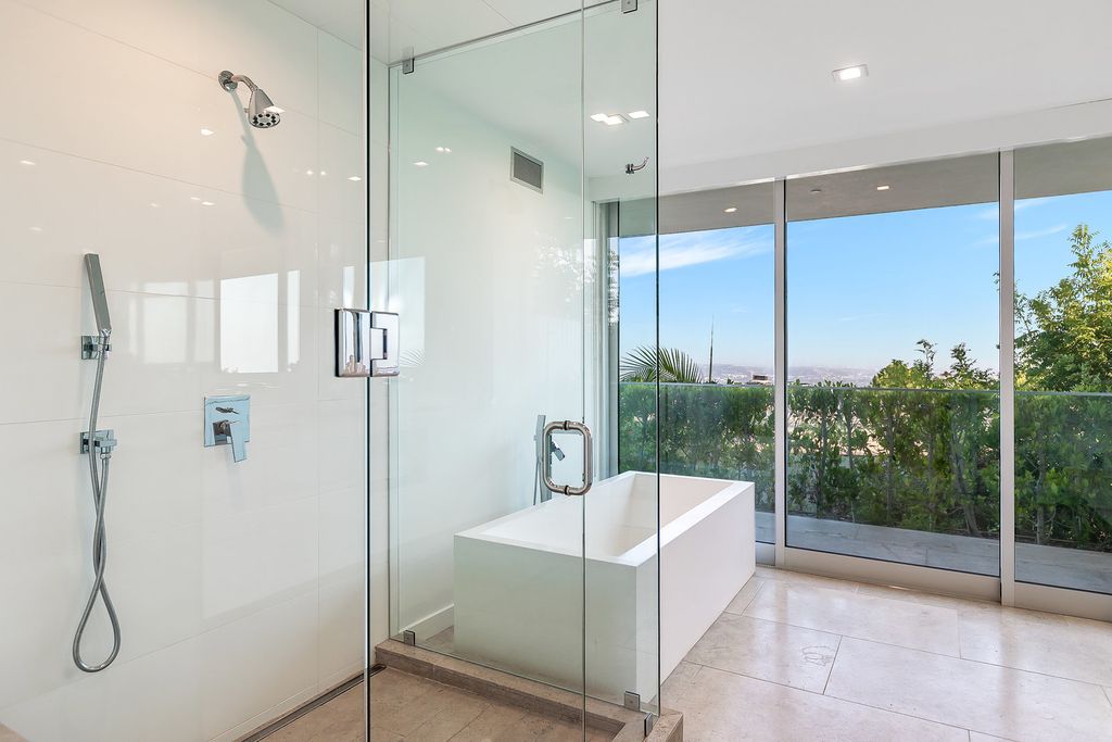 The Home in Beverly Hills is a totally remodeled and updated contemporary estate with head on city to ocean views now available for sale. This home located at 1476 Carla Rdg, Beverly Hills, California