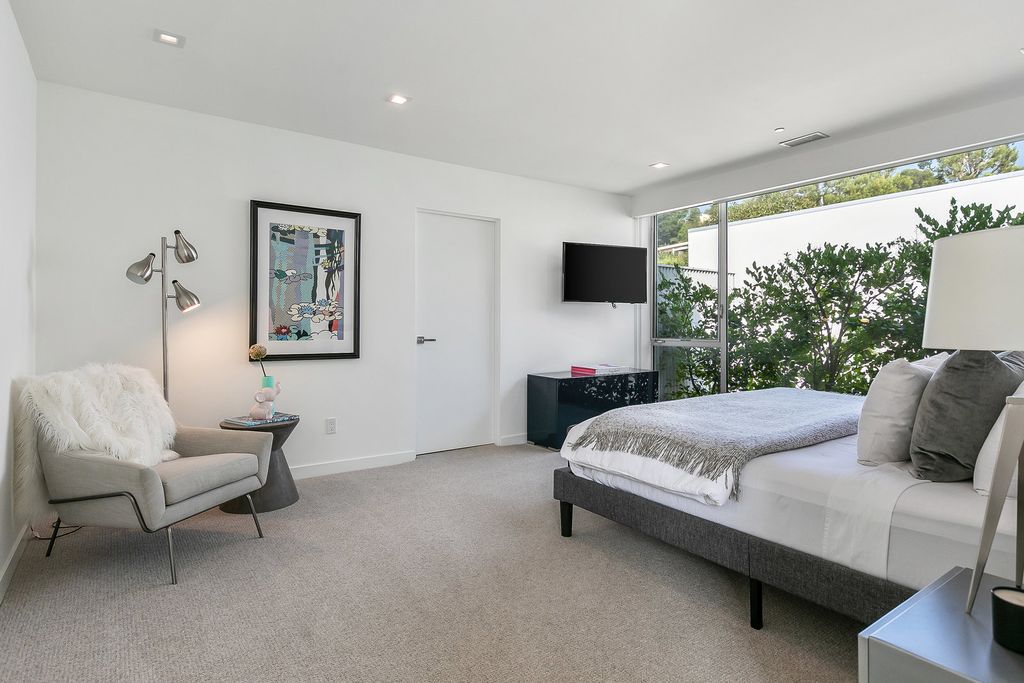 The Home in Beverly Hills is a totally remodeled and updated contemporary estate with head on city to ocean views now available for sale. This home located at 1476 Carla Rdg, Beverly Hills, California