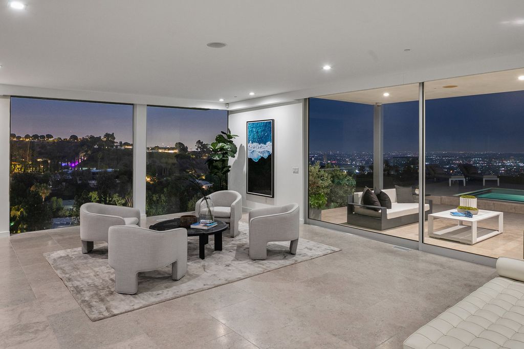 The Home in Beverly Hills is a totally remodeled and updated contemporary estate with head on city to ocean views now available for sale. This home located at 1476 Carla Rdg, Beverly Hills, California