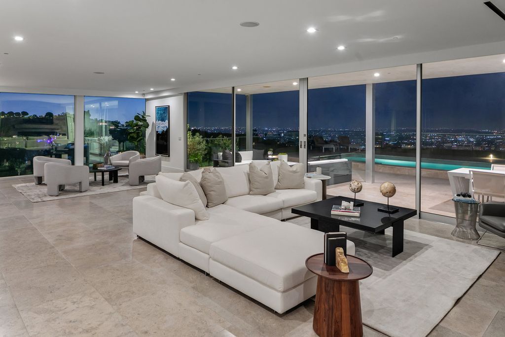 The Home in Beverly Hills is a totally remodeled and updated contemporary estate with head on city to ocean views now available for sale. This home located at 1476 Carla Rdg, Beverly Hills, California
