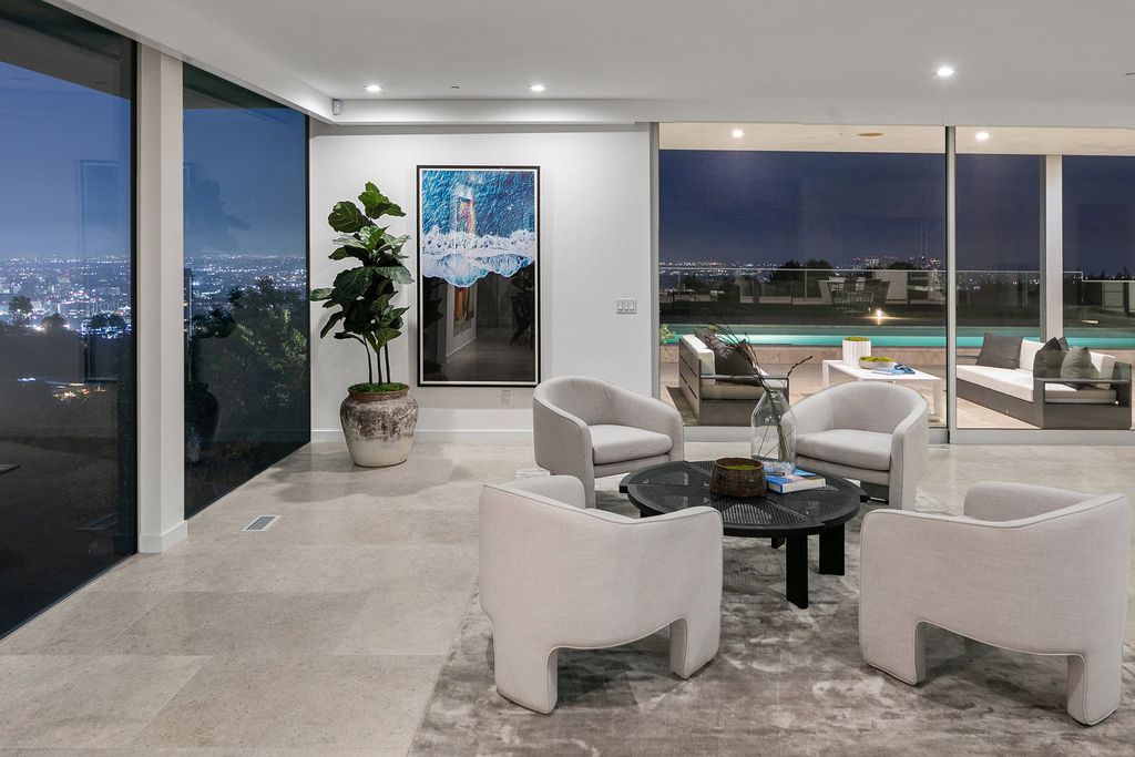 The Home in Beverly Hills is a totally remodeled and updated contemporary estate with head on city to ocean views now available for sale. This home located at 1476 Carla Rdg, Beverly Hills, California