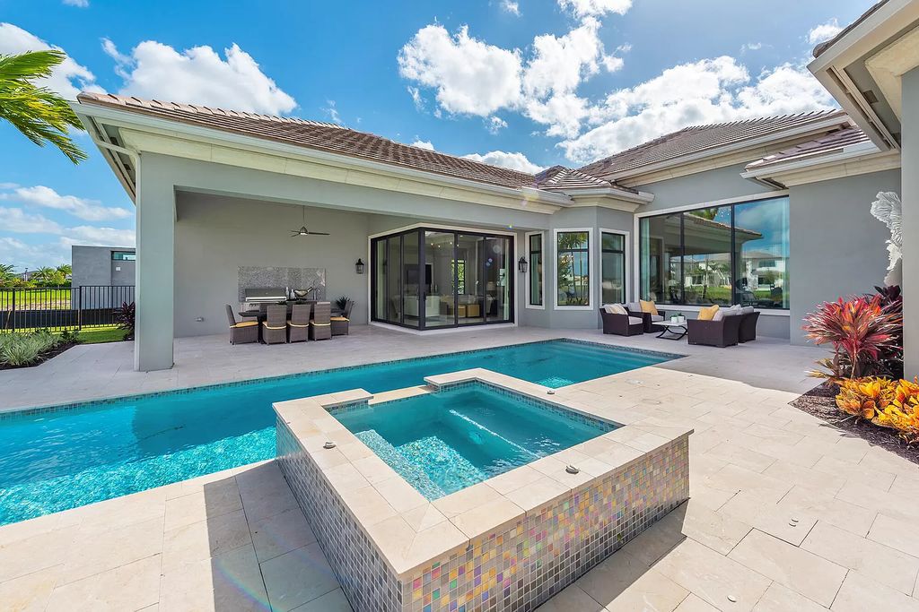 The Home in Boca Raton is a stunning transitional one story estate has Amazing custom pool with spill over spa and natural stone decking now available for sale. This home located at 17236 Brulee Breeze Way, Boca Raton, Florida