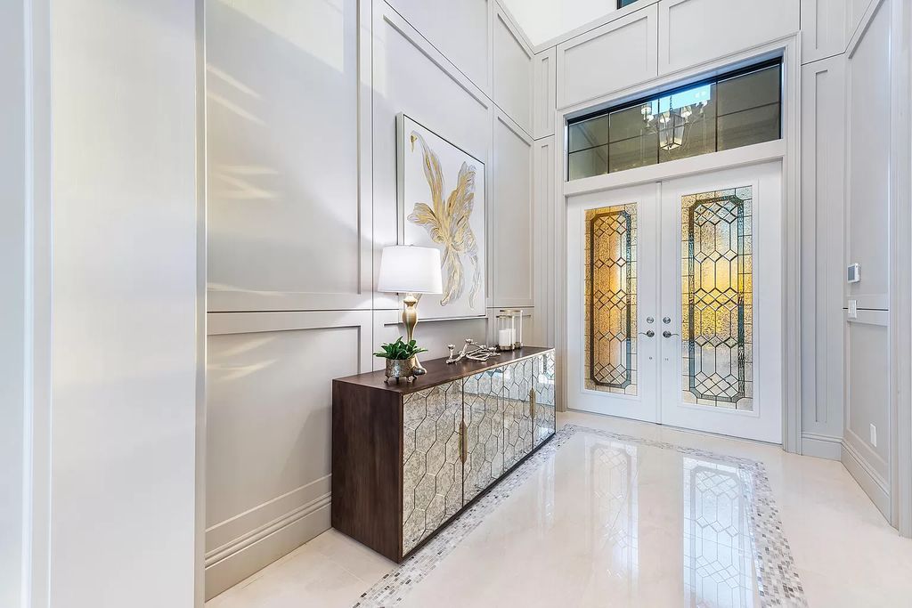 The Home in Boca Raton is a stunning transitional one story estate has Amazing custom pool with spill over spa and natural stone decking now available for sale. This home located at 17236 Brulee Breeze Way, Boca Raton, Florida
