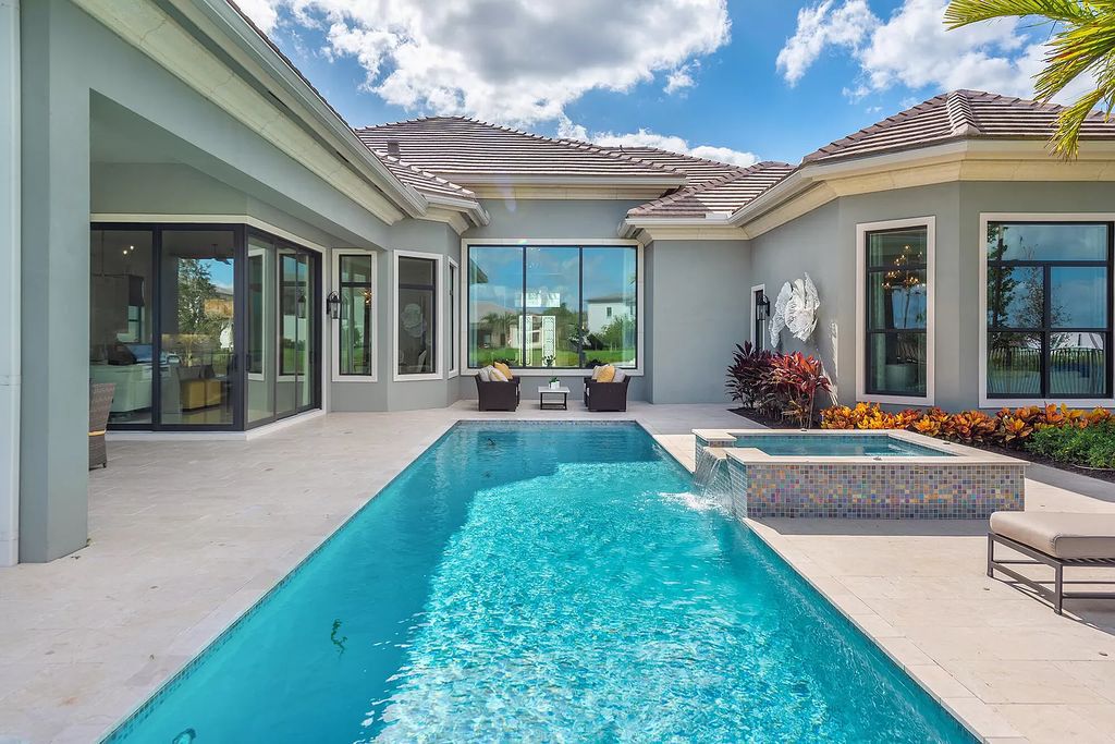 The Home in Boca Raton is a stunning transitional one story estate has Amazing custom pool with spill over spa and natural stone decking now available for sale. This home located at 17236 Brulee Breeze Way, Boca Raton, Florida