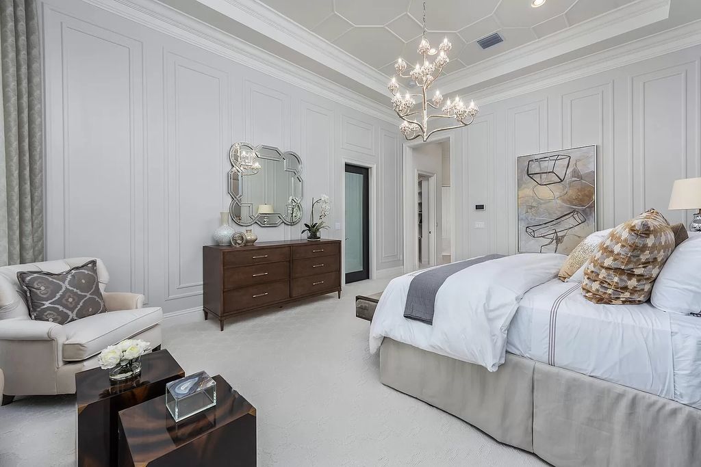 The Home in Boca Raton is a stunning transitional one story estate has Amazing custom pool with spill over spa and natural stone decking now available for sale. This home located at 17236 Brulee Breeze Way, Boca Raton, Florida