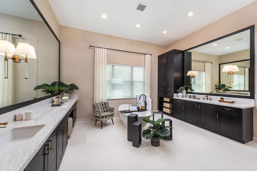 The Boca Raton Home offers a contemporary Geometric Pool with Negative Edge spa and gorgeous upgraded polished Travertine deck overlooking the lake now available for sale. This home located at 17161 Ludovica Ln, Boca Raton, Florida