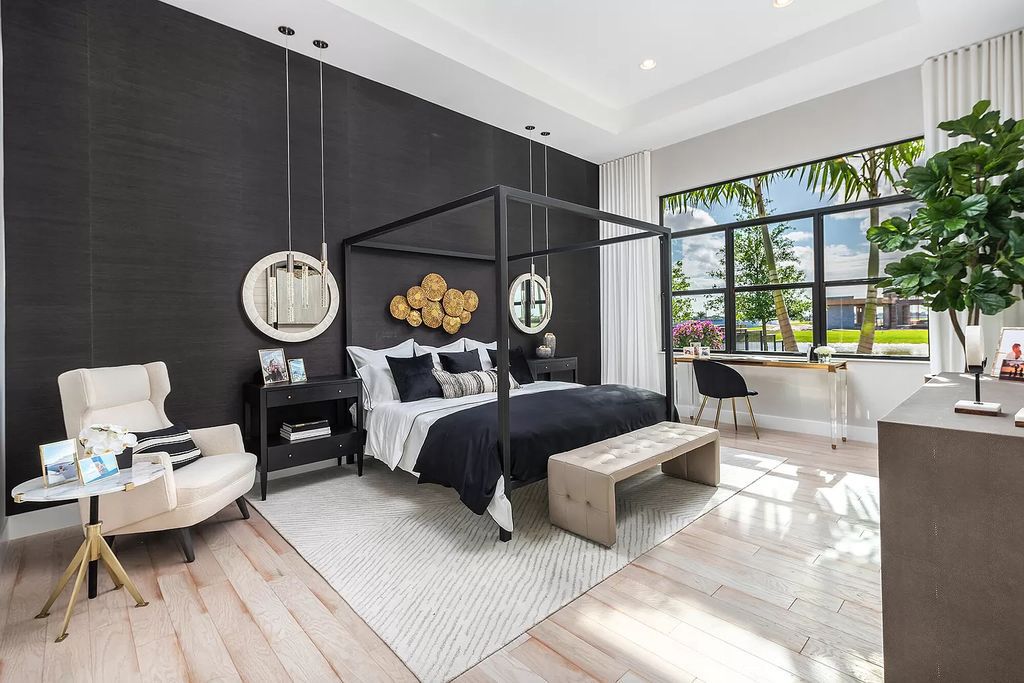 The Boca Raton Home offers a contemporary Geometric Pool with Negative Edge spa and gorgeous upgraded polished Travertine deck overlooking the lake now available for sale. This home located at 17161 Ludovica Ln, Boca Raton, Florida