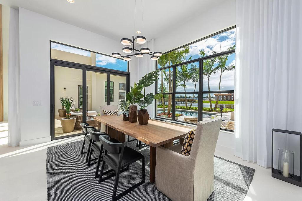 The Boca Raton Home offers a contemporary Geometric Pool with Negative Edge spa and gorgeous upgraded polished Travertine deck overlooking the lake now available for sale. This home located at 17161 Ludovica Ln, Boca Raton, Florida