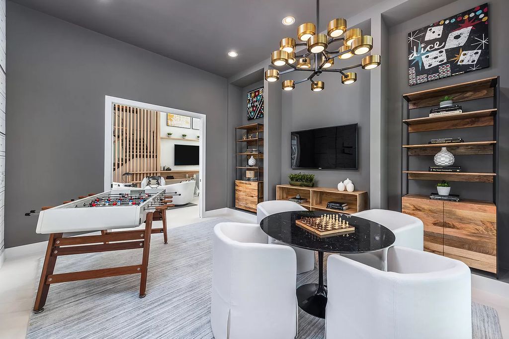 The Boca Raton Home offers a contemporary Geometric Pool with Negative Edge spa and gorgeous upgraded polished Travertine deck overlooking the lake now available for sale. This home located at 17161 Ludovica Ln, Boca Raton, Florida