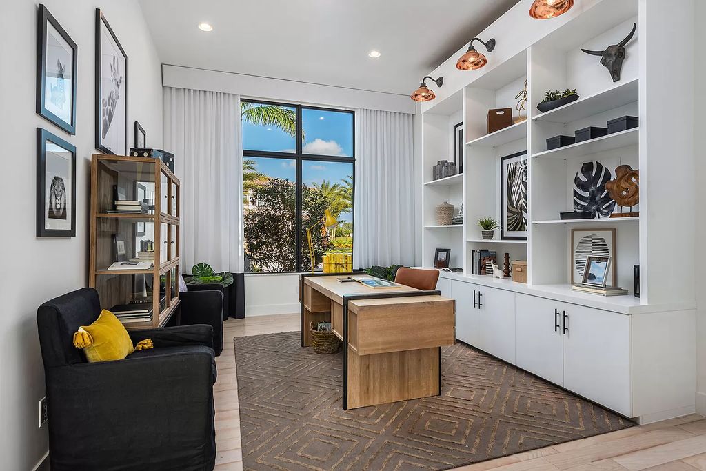 The Boca Raton Home offers a contemporary Geometric Pool with Negative Edge spa and gorgeous upgraded polished Travertine deck overlooking the lake now available for sale. This home located at 17161 Ludovica Ln, Boca Raton, Florida