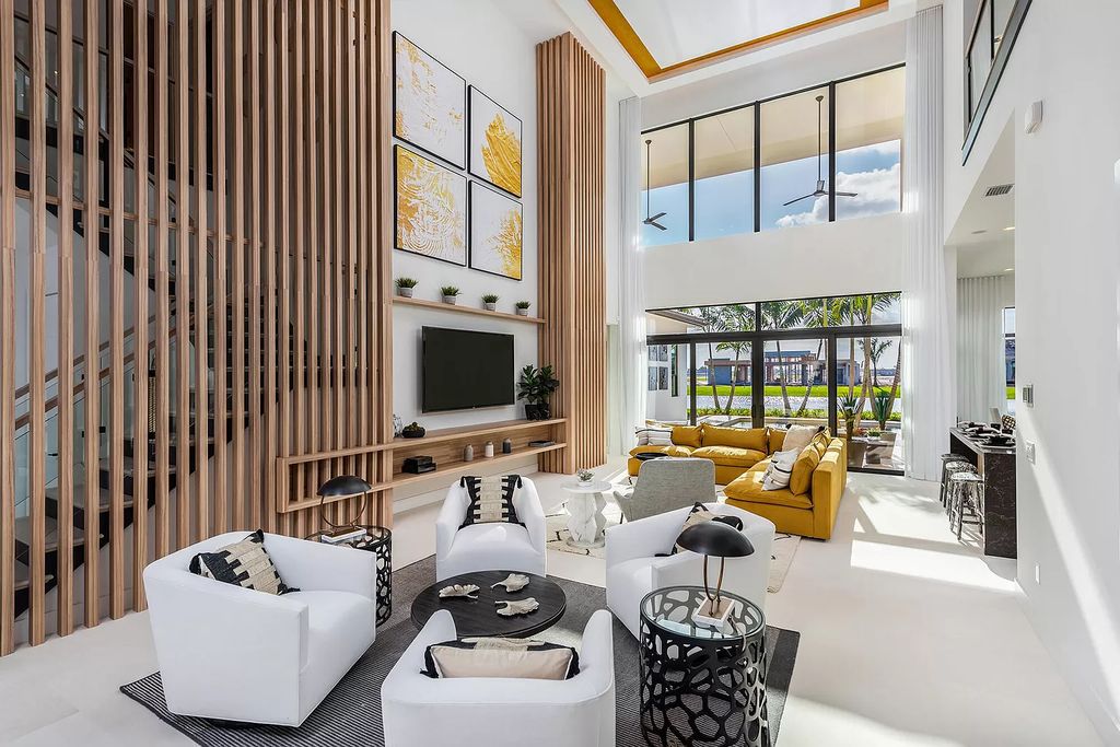 The Boca Raton Home offers a contemporary Geometric Pool with Negative Edge spa and gorgeous upgraded polished Travertine deck overlooking the lake now available for sale. This home located at 17161 Ludovica Ln, Boca Raton, Florida