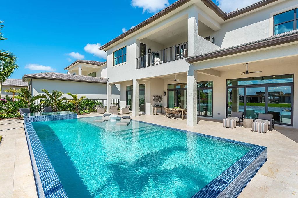 The Boca Raton Home with 2 story open great room concept floorplan and an amazing contemporary spill over pool now available for sale. This home located at 17167 Ludovica Ln, Boca Raton, Florida