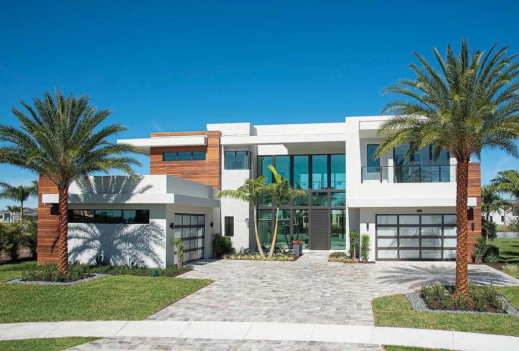The Home in Boca Raton is a magnificent Modern estate featuring flat roof, floor to ceiling glass and extraordinary Ipey wood accents now available for sale. This home located at 17224 Brulee Breeze Way, Boca Raton, Florida