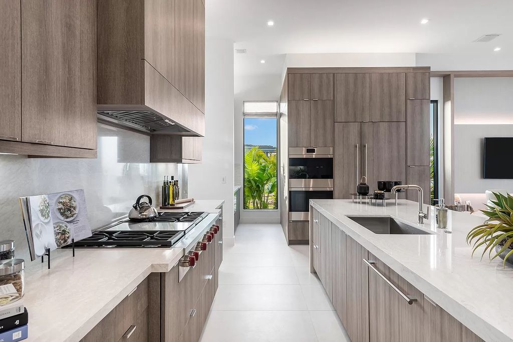 The Home in Boca Raton is a magnificent Modern estate featuring flat roof, floor to ceiling glass and extraordinary Ipey wood accents now available for sale. This home located at 17224 Brulee Breeze Way, Boca Raton, Florida