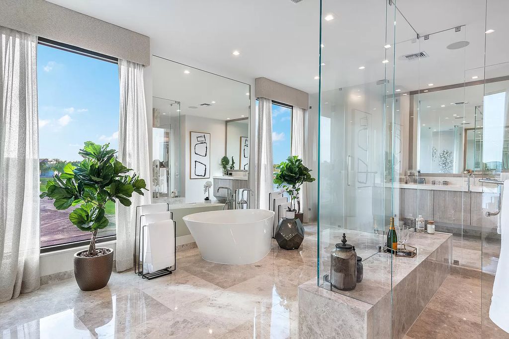 The Home in Boca Raton is a magnificent Modern estate featuring flat roof, floor to ceiling glass and extraordinary Ipey wood accents now available for sale. This home located at 17224 Brulee Breeze Way, Boca Raton, Florida