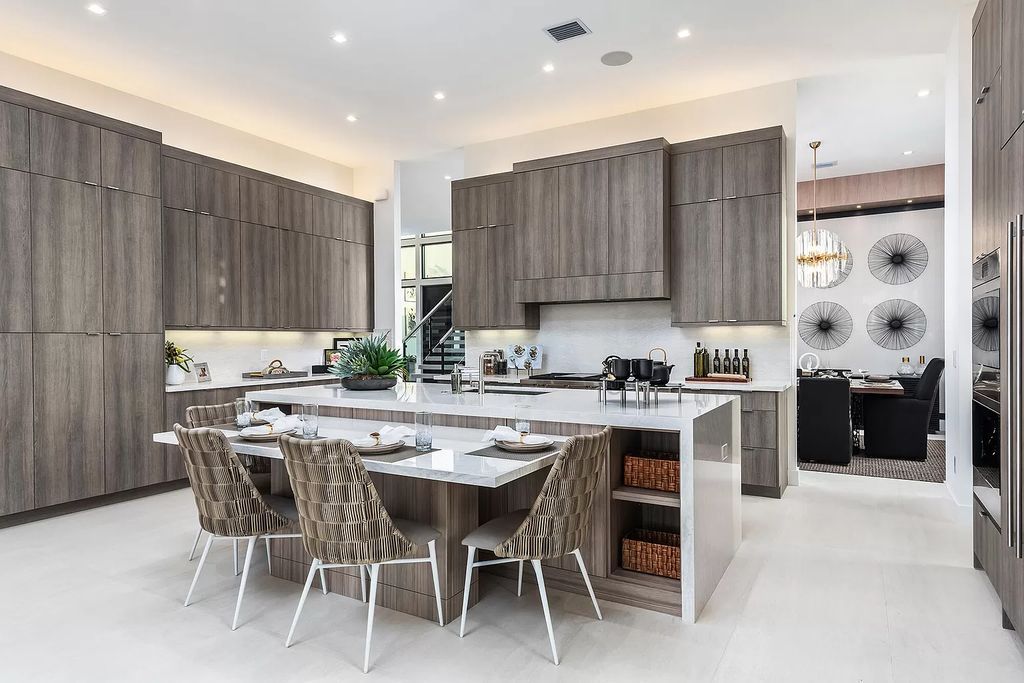 The Home in Boca Raton is a magnificent Modern estate featuring flat roof, floor to ceiling glass and extraordinary Ipey wood accents now available for sale. This home located at 17224 Brulee Breeze Way, Boca Raton, Florida
