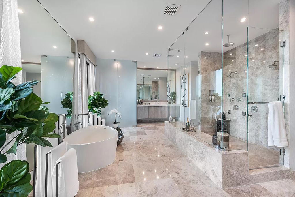 The Home in Boca Raton is a magnificent Modern estate featuring flat roof, floor to ceiling glass and extraordinary Ipey wood accents now available for sale. This home located at 17224 Brulee Breeze Way, Boca Raton, Florida