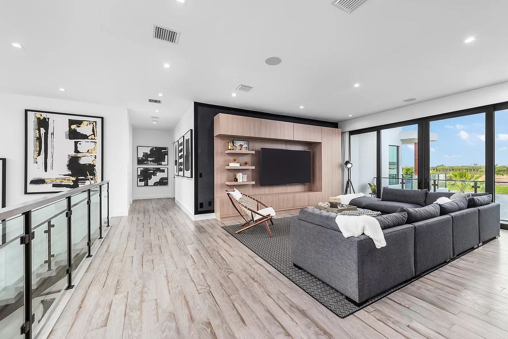 The Home in Boca Raton is a magnificent Modern estate featuring flat roof, floor to ceiling glass and extraordinary Ipey wood accents now available for sale. This home located at 17224 Brulee Breeze Way, Boca Raton, Florida