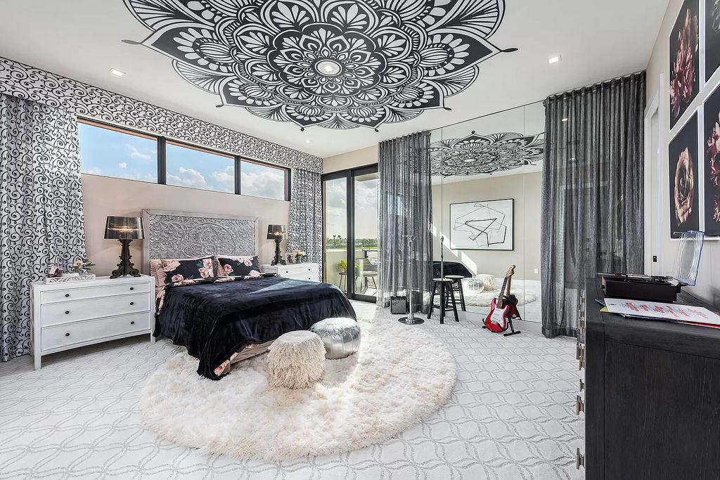 The Home in Boca Raton is a magnificent Modern estate featuring flat roof, floor to ceiling glass and extraordinary Ipey wood accents now available for sale. This home located at 17224 Brulee Breeze Way, Boca Raton, Florida