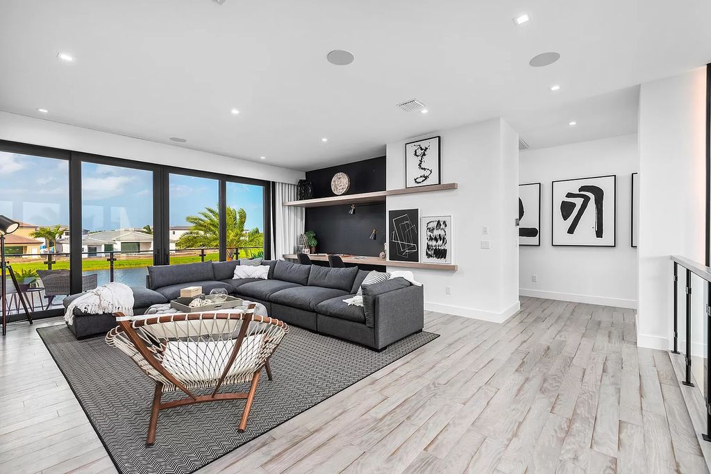The Home in Boca Raton is a magnificent Modern estate featuring flat roof, floor to ceiling glass and extraordinary Ipey wood accents now available for sale. This home located at 17224 Brulee Breeze Way, Boca Raton, Florida