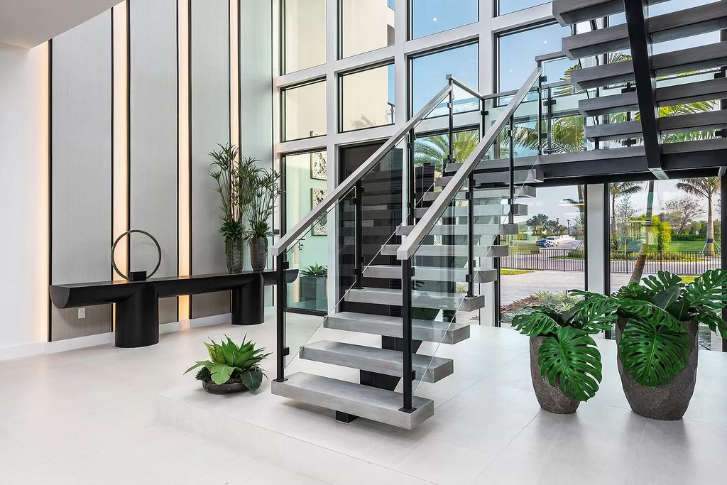 The Home in Boca Raton is a magnificent Modern estate featuring flat roof, floor to ceiling glass and extraordinary Ipey wood accents now available for sale. This home located at 17224 Brulee Breeze Way, Boca Raton, Florida