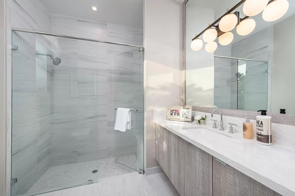The Home in Boca Raton is a magnificent Modern estate featuring flat roof, floor to ceiling glass and extraordinary Ipey wood accents now available for sale. This home located at 17224 Brulee Breeze Way, Boca Raton, Florida