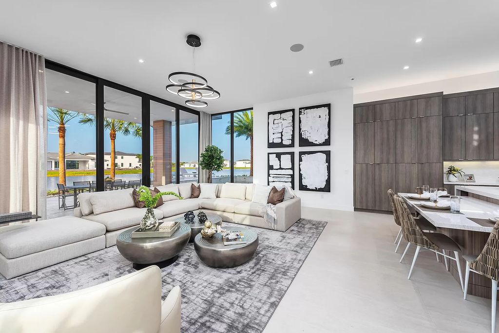 The Home in Boca Raton is a magnificent Modern estate featuring flat roof, floor to ceiling glass and extraordinary Ipey wood accents now available for sale. This home located at 17224 Brulee Breeze Way, Boca Raton, Florida