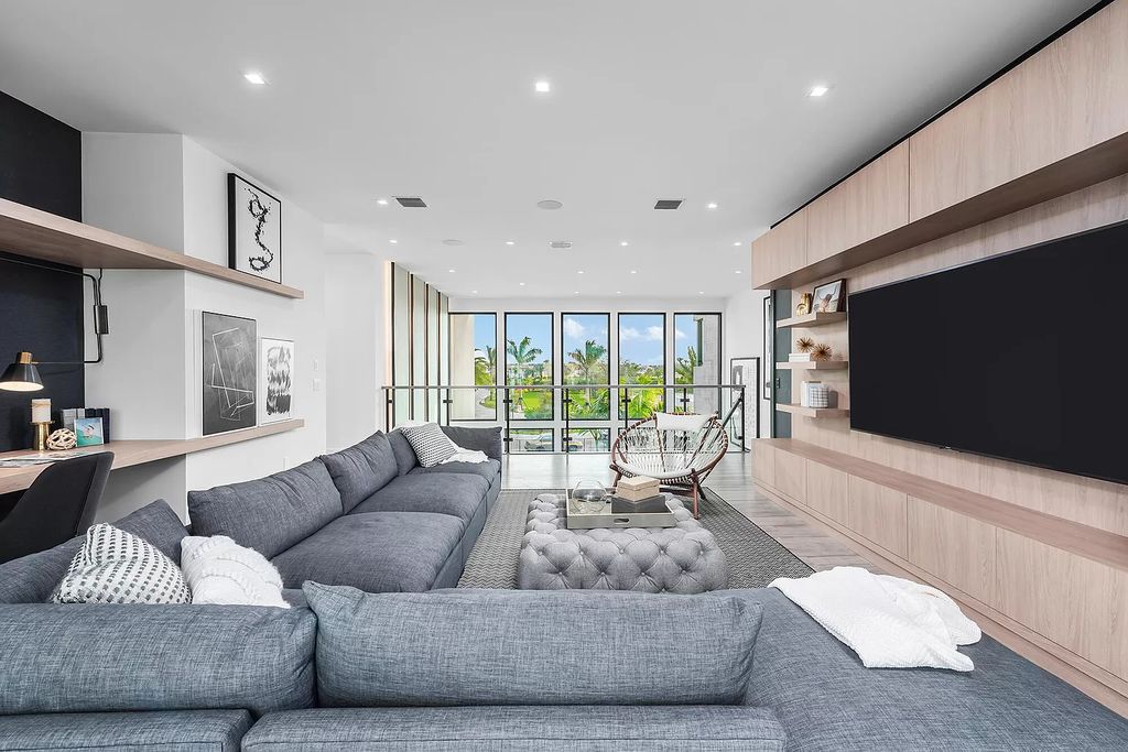 The Home in Boca Raton is a magnificent Modern estate featuring flat roof, floor to ceiling glass and extraordinary Ipey wood accents now available for sale. This home located at 17224 Brulee Breeze Way, Boca Raton, Florida