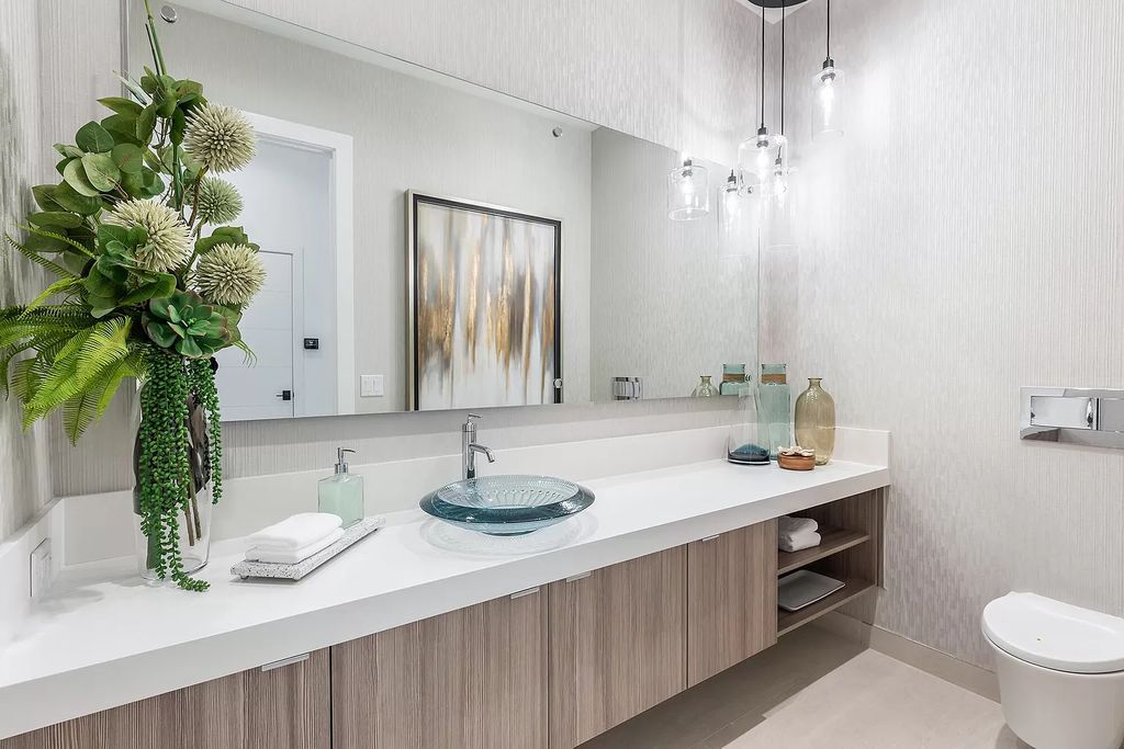 The Home in Boca Raton is a magnificent Modern estate featuring flat roof, floor to ceiling glass and extraordinary Ipey wood accents now available for sale. This home located at 17224 Brulee Breeze Way, Boca Raton, Florida
