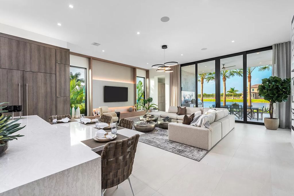 The Home in Boca Raton is a magnificent Modern estate featuring flat roof, floor to ceiling glass and extraordinary Ipey wood accents now available for sale. This home located at 17224 Brulee Breeze Way, Boca Raton, Florida