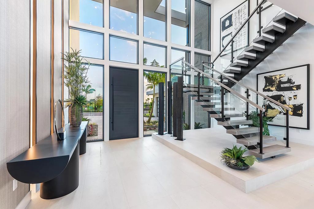 The Home in Boca Raton is a magnificent Modern estate featuring flat roof, floor to ceiling glass and extraordinary Ipey wood accents now available for sale. This home located at 17224 Brulee Breeze Way, Boca Raton, Florida
