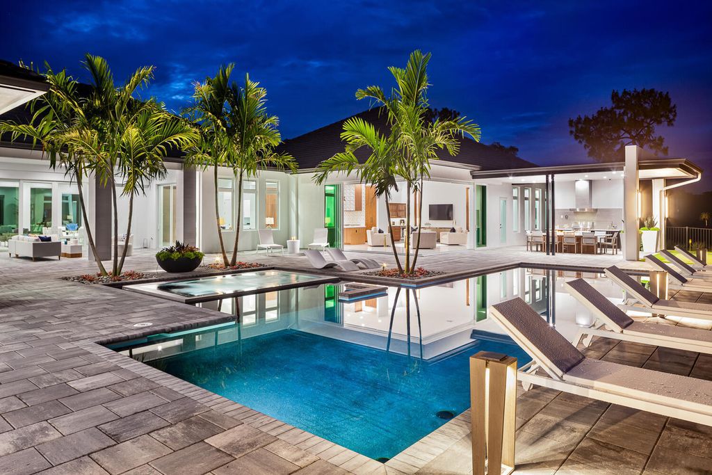 The Home in Naples is a perfect new estate expertly crafted with cutting-edge international design and mid-century modern influences now available for sale. This home located at 4445 Silver Fox Dr, Naples, Florida