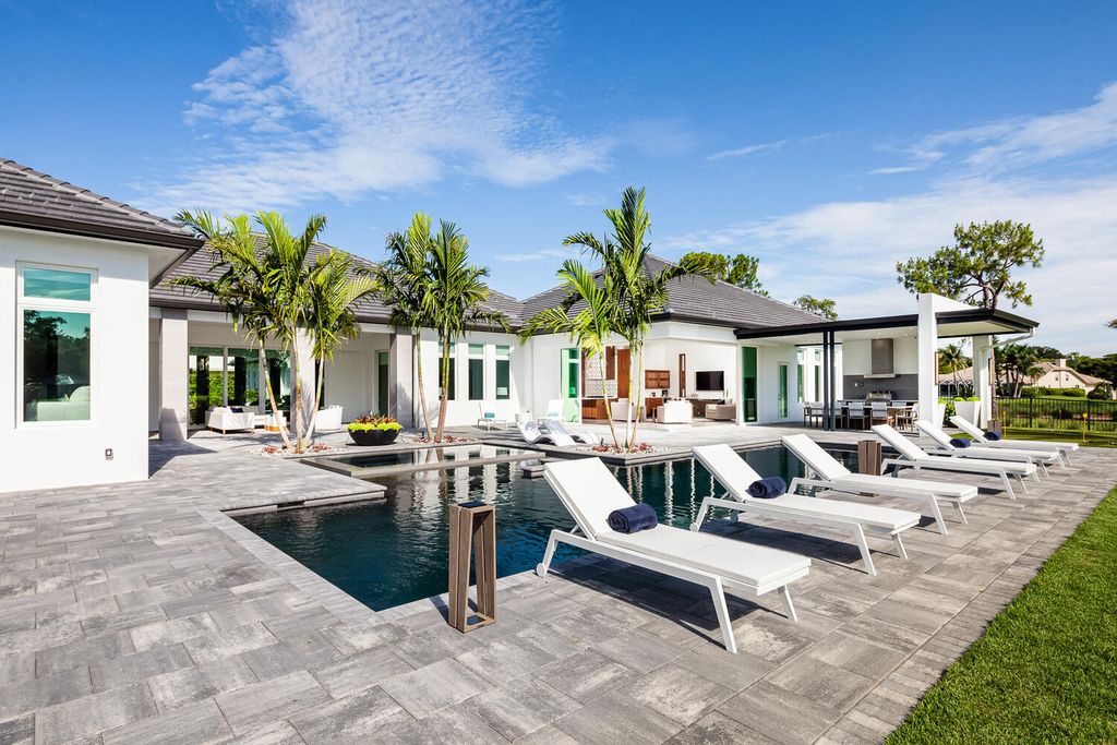 The Home in Naples is a perfect new estate expertly crafted with cutting-edge international design and mid-century modern influences now available for sale. This home located at 4445 Silver Fox Dr, Naples, Florida