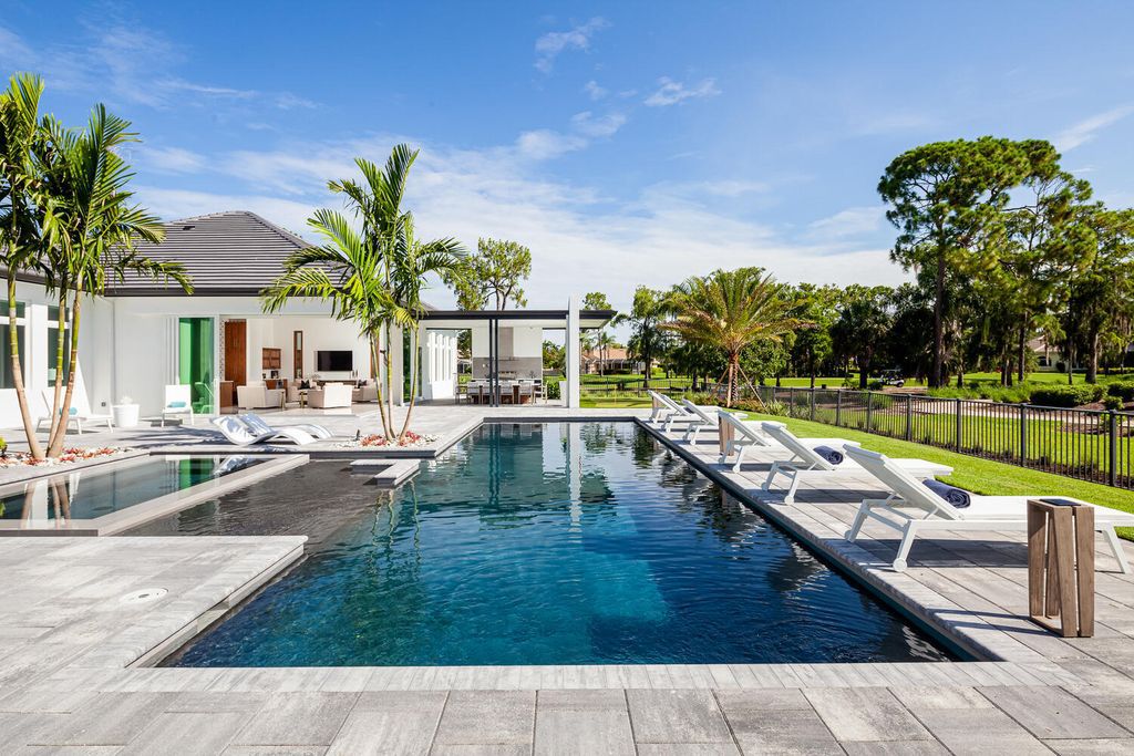 The Home in Naples is a perfect new estate expertly crafted with cutting-edge international design and mid-century modern influences now available for sale. This home located at 4445 Silver Fox Dr, Naples, Florida