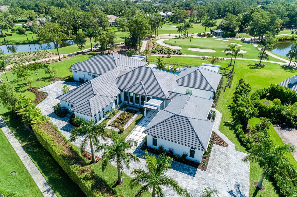 The Home in Naples is a perfect new estate expertly crafted with cutting-edge international design and mid-century modern influences now available for sale. This home located at 4445 Silver Fox Dr, Naples, Florida