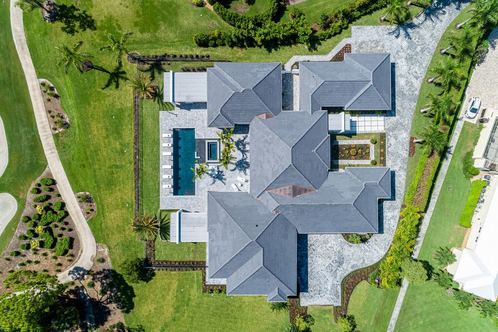 The Home in Naples is a perfect new estate expertly crafted with cutting-edge international design and mid-century modern influences now available for sale. This home located at 4445 Silver Fox Dr, Naples, Florida