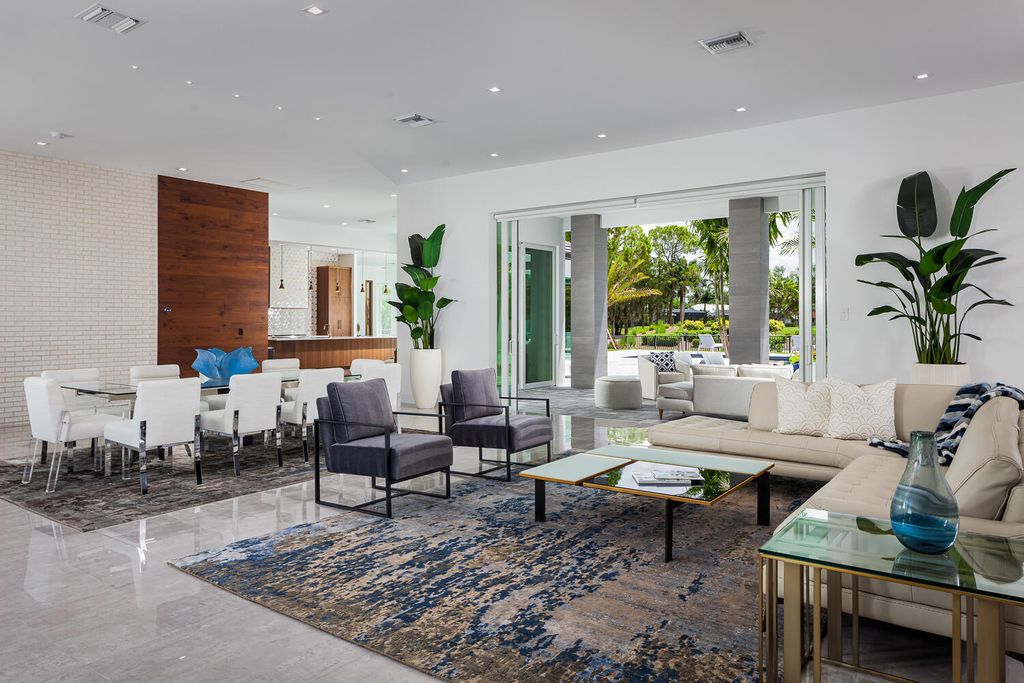 The Home in Naples is a perfect new estate expertly crafted with cutting-edge international design and mid-century modern influences now available for sale. This home located at 4445 Silver Fox Dr, Naples, Florida