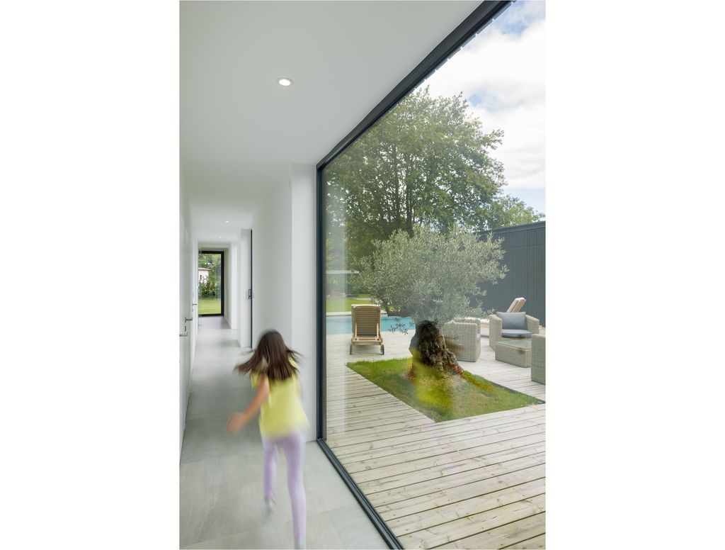 House U, Stunning rectangular shape House open to the sky by Atelier 56S