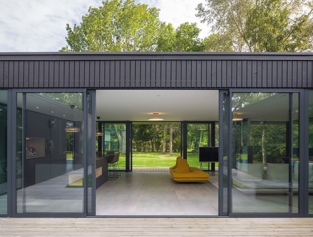 House U, Stunning rectangular shape House open to the sky by Atelier 56S
