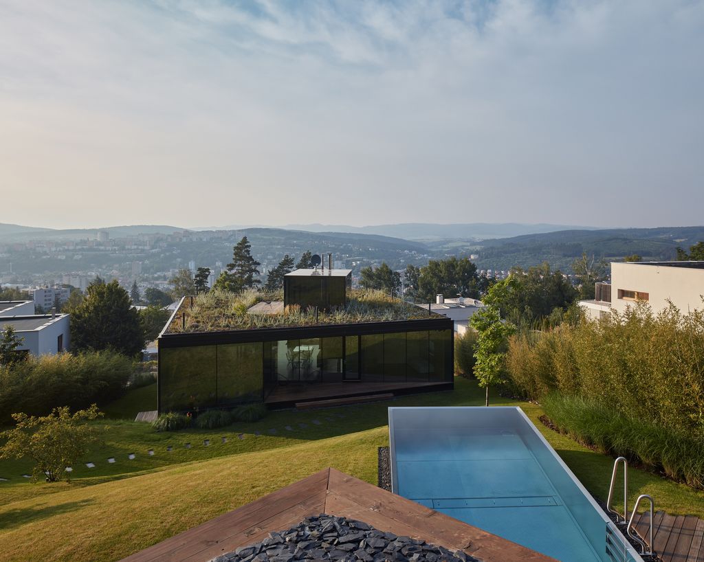 Lazy House Sits Between a Forest and a Valley by  Petrjanda/ Brainwork