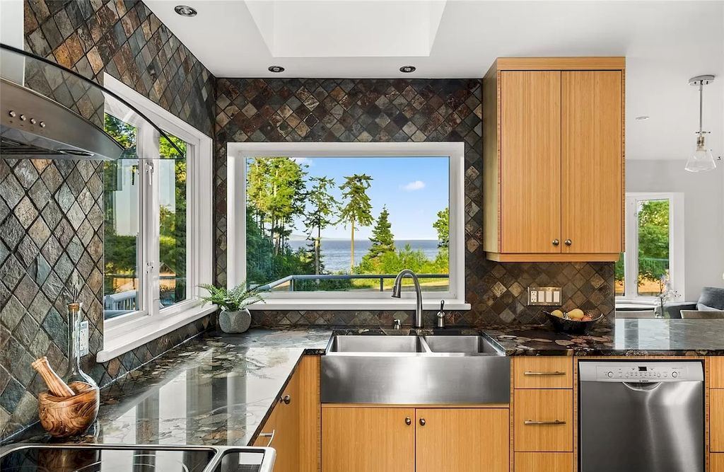 The Spectacular Beachfront Estate in Saanich is a luxury home now available for sale. This home is located at 5605 Parker Ave, Saanich, BC V8Y 2N2, Canada