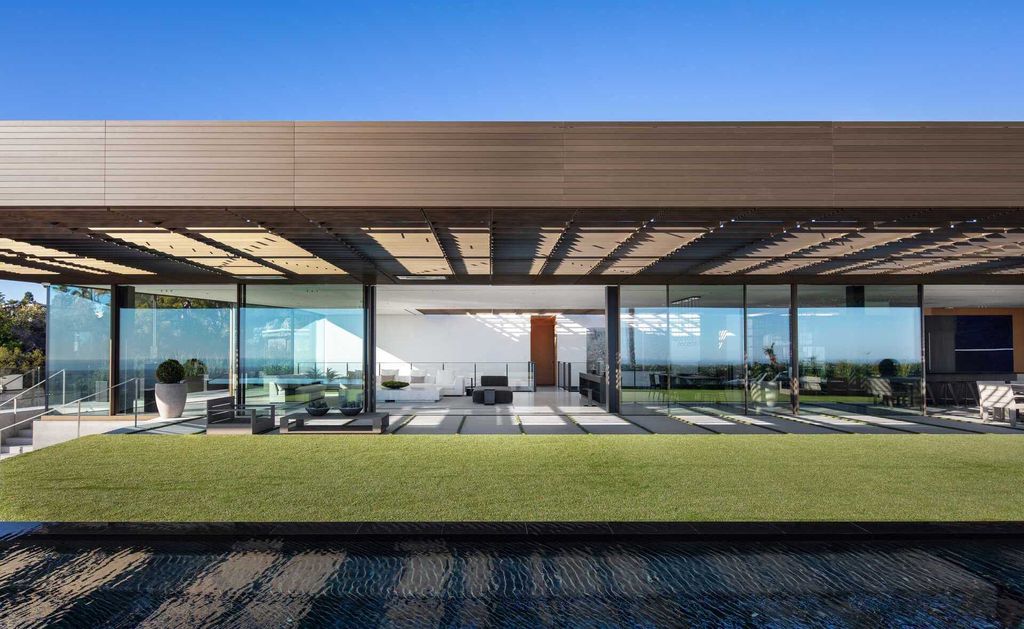 The Bird Streets Mansion is a spectacular new contemporary estate was envisioned by architect Zoltan Pali and home builder Dugally Oberfeld now available for sale. This home located at 9344 Nightingale Dr, Los Angeles, California