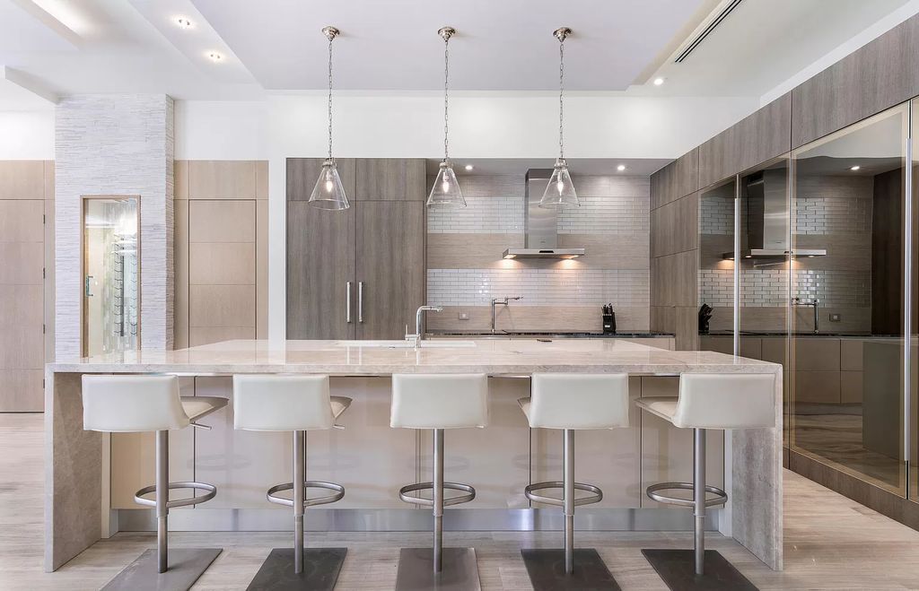 The Delray Beach Home is a beautifully designed two story contemporary estate with tropically landscaped back yard now available for sale. This home located at 609 Seagate Dr, Delray Beach, Florida