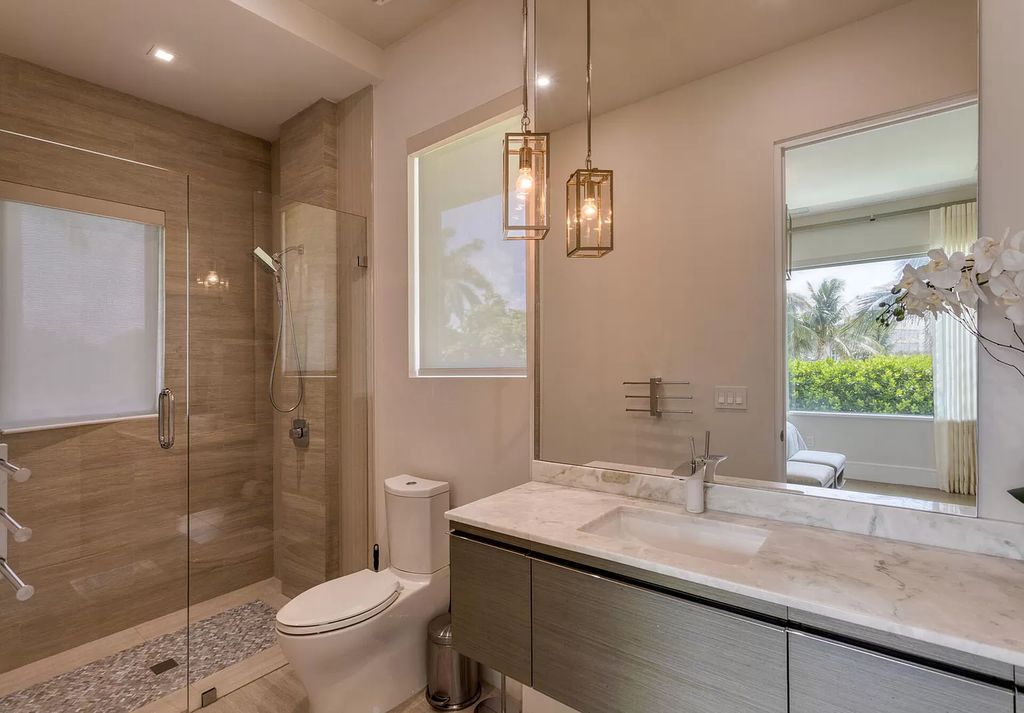 The Delray Beach Home is a beautifully designed two story contemporary estate with tropically landscaped back yard now available for sale. This home located at 609 Seagate Dr, Delray Beach, Florida