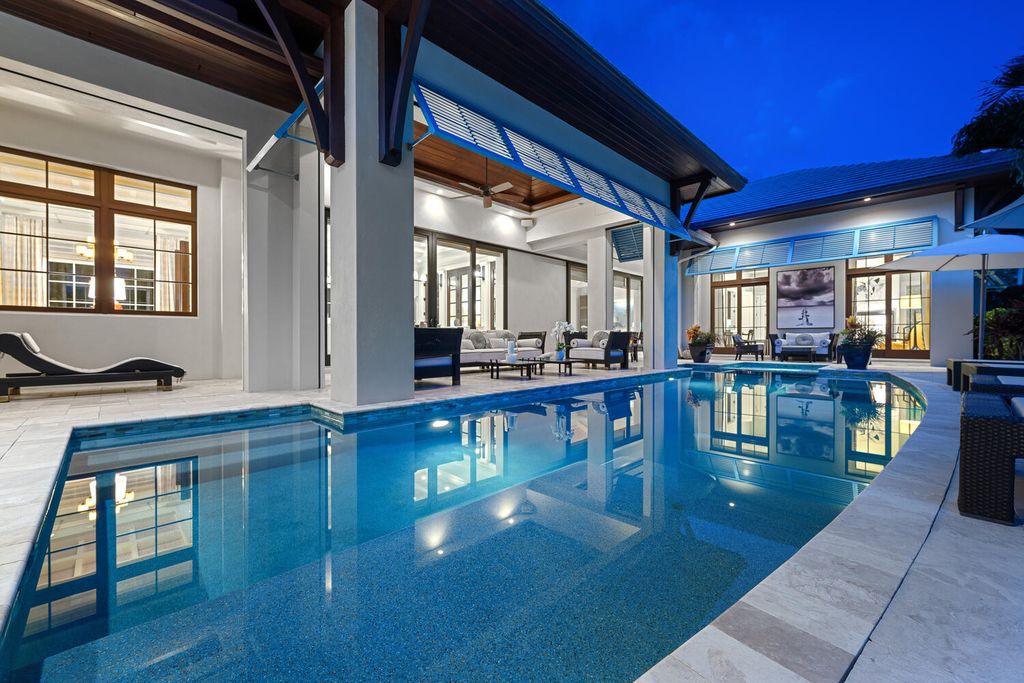 The Home in Naples is an exquisite estate now with glass walls open to outdoor veranda & pool blending indoor and outdoor available for sale. This home located at 2284 Crayton Rd, Naples, Florida