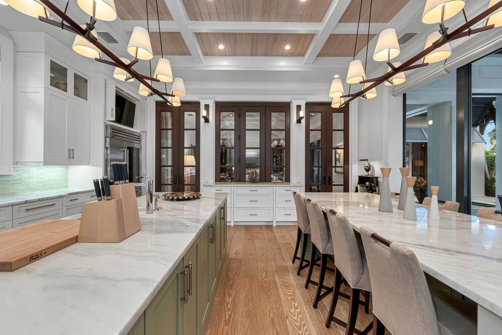 The Home in Naples is an exquisite estate now with glass walls open to outdoor veranda & pool blending indoor and outdoor available for sale. This home located at 2284 Crayton Rd, Naples, Florida