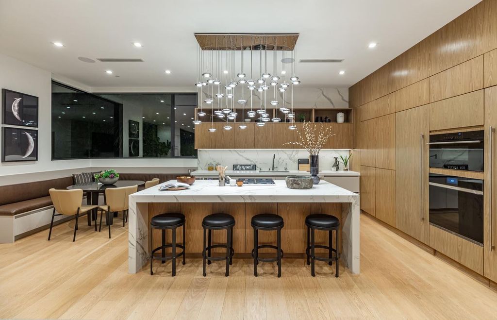 The Los Angeles Home is a stunning three-story architectural masterpiece located on a prestigious street with panoramic ocean views now available for sale. This home located at 815 N Tigertail Rd, Los Angeles, California