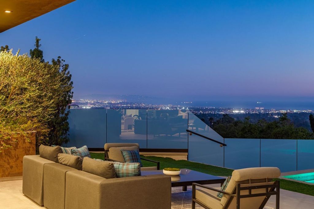 The Los Angeles Home is a stunning three-story architectural masterpiece located on a prestigious street with panoramic ocean views now available for sale. This home located at 815 N Tigertail Rd, Los Angeles, California
